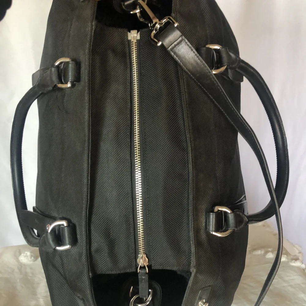 TUMI large black weekender bag. Leather and nylon. Detachable strap.